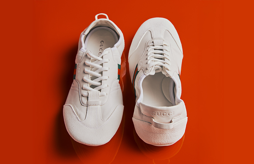 Nike Moon Racer OG sneakers in cream with red Swoosh and gum sole on red background — Shop New Releases